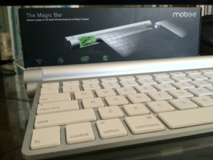 The Magic Bar installed in a keyboard, Charging Dock, and Box